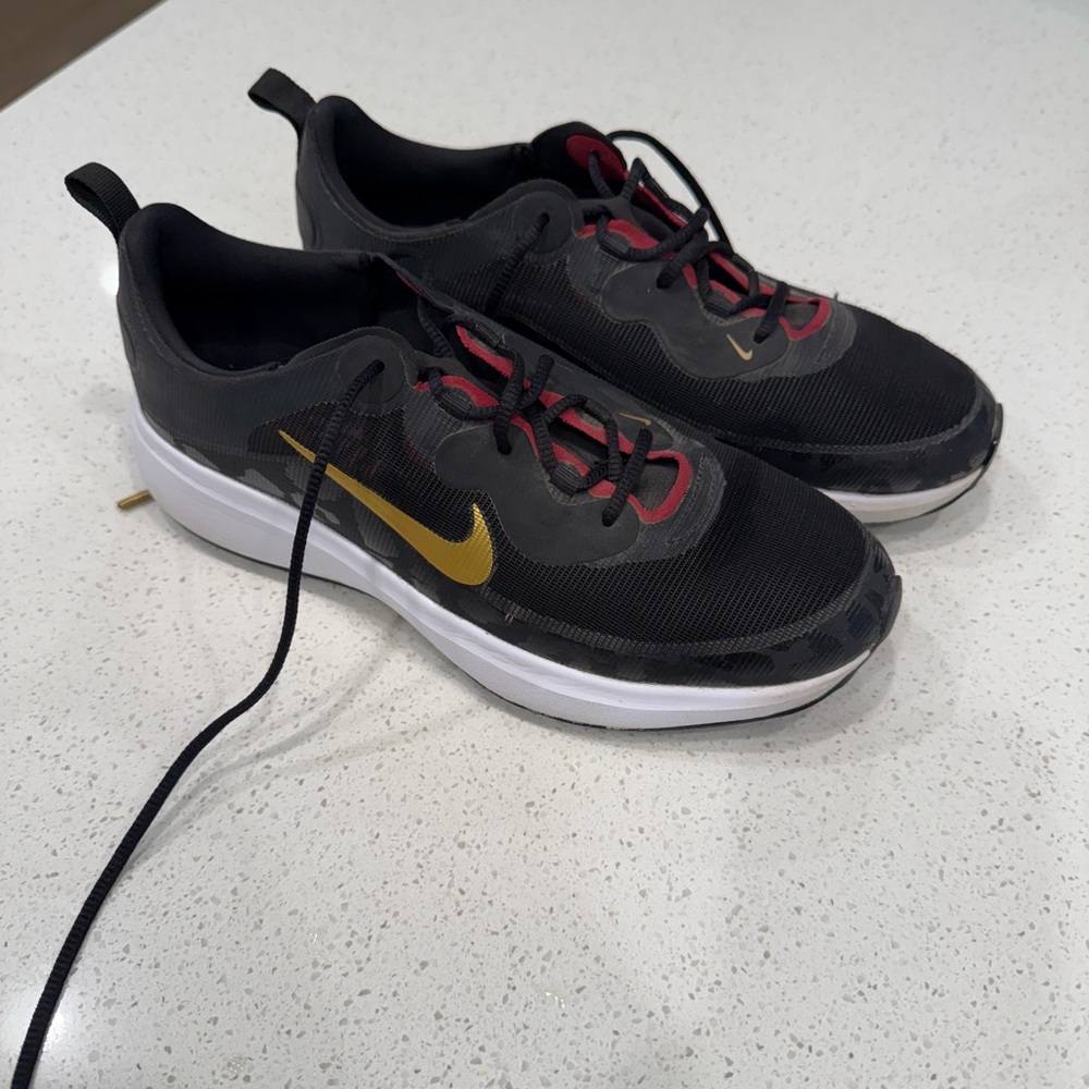 Nike Black and Gold Athletic Shoes Modern Design